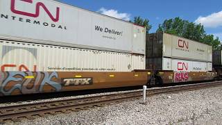 CN 2580, 2572 pulling a Westbound intermodal container train at Vicksburg, Michigan