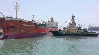 Time lapse of Tug boat towing a mega ship out of berth in tuticorin port