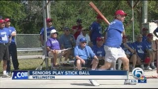 Seniors play stick ball