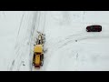 veekmas tiehöylä auraa veekmas motorgrader snowplowing aerialview