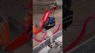 Mini concrete pump in action. Pouring a column in a wall