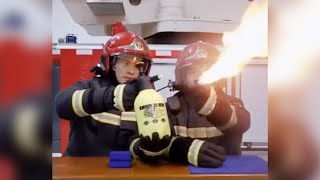 Firefighter calmly snuffs out flame during safety demonstration