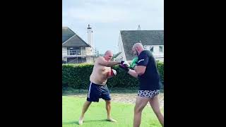 Tyson fury on the pads with his dad