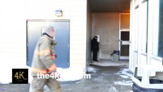 4K UHD - Team of paramedics rushing to hospital door while doing CPR