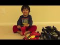 kid playing with remote control toys batman imaginext batbot