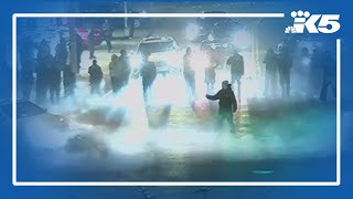 Street racers overtake Seattle intersection, blocking traffic with motorized rental scooters