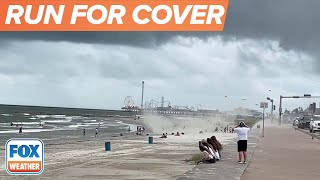 Watch: Waterspout Comes Ashore, Sends Beachgoers Running In Texas