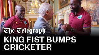 King Charles fist-bumps West Indies cricketer