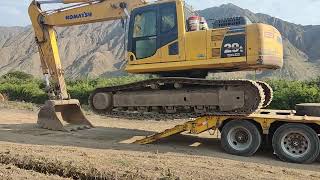 subir excavadora a la cama baja