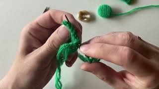 Placing the knitted cover on the button