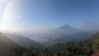 Fuji appearing from the clouds seen on the FUJIYAMA Twin Terrace in the early morning August 4, 2023