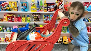 Monkey Baby Bim Bim doing shopping for toys in the supermarket and eats jelly with puppy