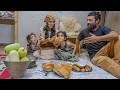 A young family lives in a 100-year-old house and Mother prepares dinner for the family.