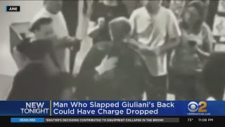 Man who slapped Giuliani's back could have charged dropped