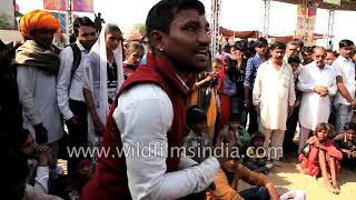 Street performer dazzles rural audience with magic tricks at Pushkar fair in Rajasthan