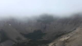 Descending Mount Blakiston with Lineham creek and lakes visible under fog