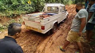 Escorting a pick up ferrying construction supplies to a hard to reach spot.