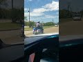 leading the funeral procession with police escorts motorcycle cop