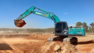 KOBELCO SK200-8 SUPER XM Excavator Loading Dump Truck