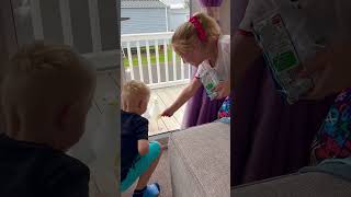 Child's Laughter at Seagull's Failed Feeding Attempt