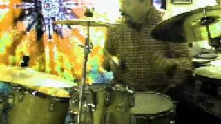 Dixie Dooley plays the drums