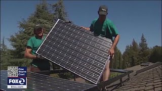 Solar energy advocates protest policy changes that would reduce rebates