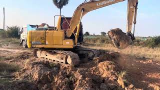 Mastering Truck Loading: Komatsu PC-210 Excavator in Action