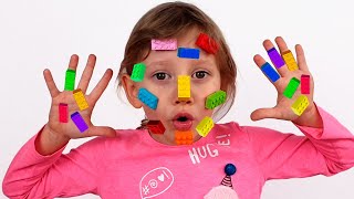 Alena and mom plays with Lego Toys on their Faces and Hands | Clap your hands