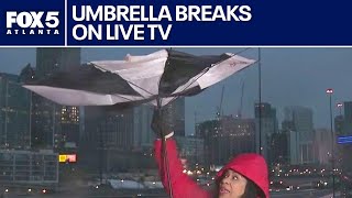 Strong Atlanta wind snaps reporter's umbrella on live tv | FOX 5 News