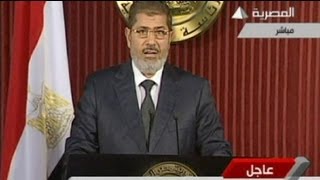 Egypt's President Mursi appears in public to address violence over draft constitution