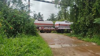 BTPGLN Freight Train Passes Through A Railroad Level Crossing