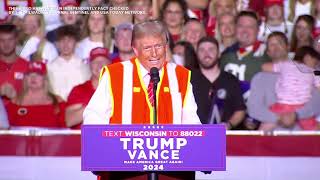 Trump talks about lack of certainty getting into garbage truck, wearing vest at Green Bay rally