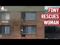 FDNY Rescues Woman Hanging Out of 16th Floor Window During Harlem Fire | NBC New York