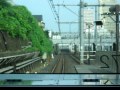 tokyo jr keihin tohoku line train pacing a yamanote line train with crowded platform