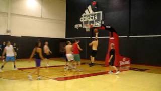 Practicing in the Raptors' training gym with coach Jay Triano