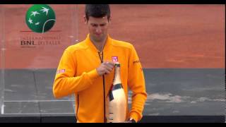 Champagne smashes Novak Djokovic