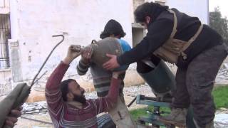 Islamic Front members attack Assad regime forces near Aleppo