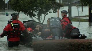 Crews Rescue People, Pets Swim to Safety