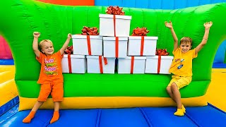 Niki and Chris Surprises Box Challenge in inflatable castle