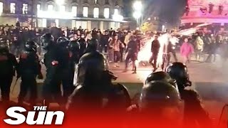 Riot police throw canister that explodes in protester's face in Paris demonstrations