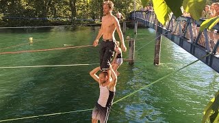 Daredevils Perform Slackline Shoulder Stand Over River