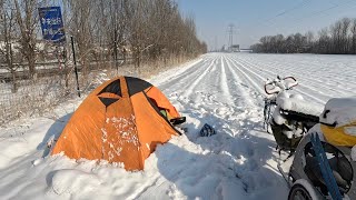 单车骑行中国838天，下了一天雪，坚难的推行20公里