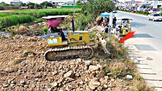 Amazing !! Project teamwork bulldozer Komatsu D31p pushing soil near the road Highway,20ton truck.