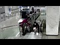 security guard hops over handrail to stop toddler from falling down escalator