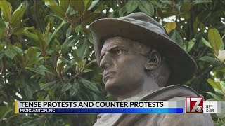 Armed protesters, counterprotesters assemble at site of NC Confederate statue