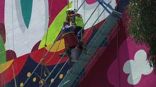 Relief as mural painters are rescued from dangling scaffold in Mexico City