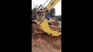 CAT 330 with USA Attachments excavator tree stumper being coupled