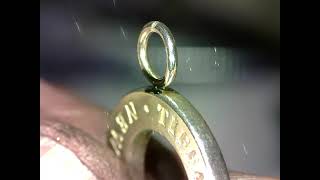 Welding a Sterling silver jump ring with a laser.