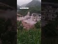 Building collapses into floodwaters in China | AccuWeather