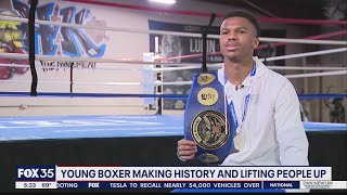 Young boxer making history, lifting people up